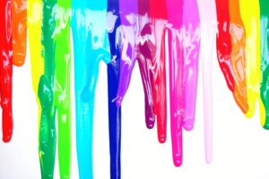 colours of different paint types dripping on a screen