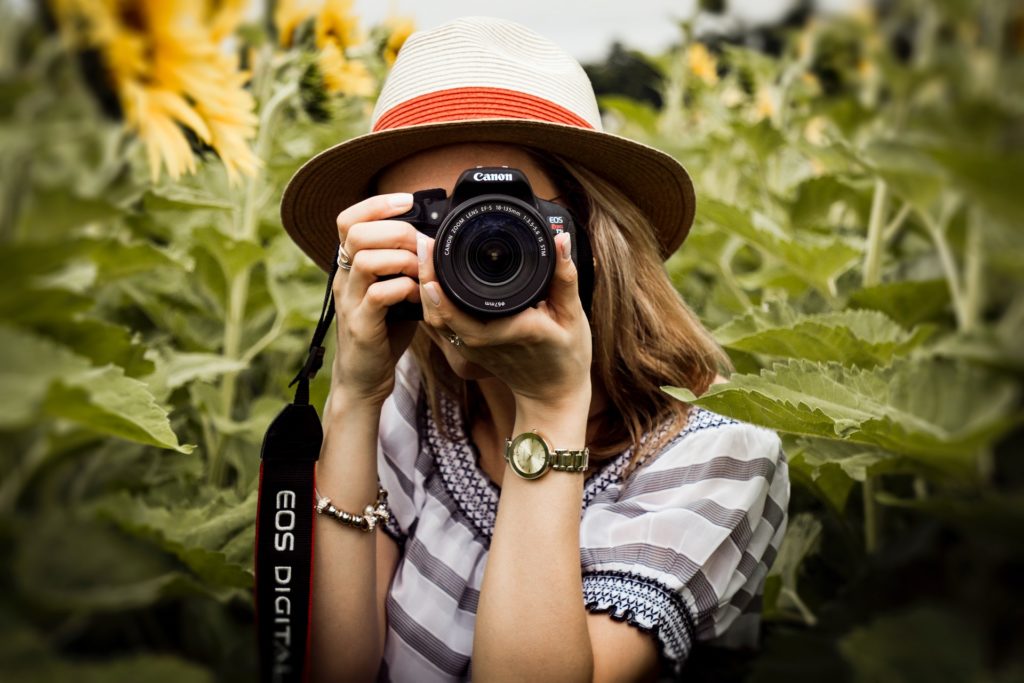 a best buy camera from Canon DSLR handled by a young girl for shooting